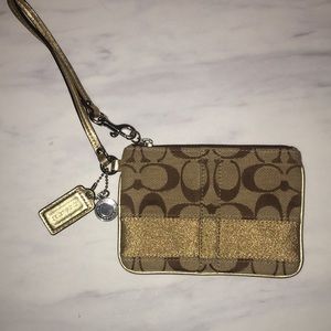 Brown and gold Coach wristlet